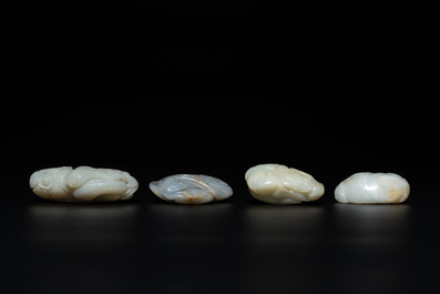 Five Chinese white, celadon and russet jade carvings of three melons, a lotus pod and a lingzhi, 19th C.