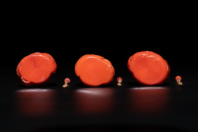 A set of ten Chinese coral-red glass Luohan-form snuff bottles, 20th C.