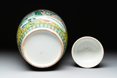 A pair of Chinese famille verte yellow-ground vases and covers with narrative design, 19th C.