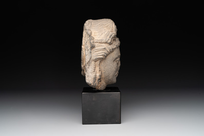 A Gandhara grey schist relief fragment of a Bodhisattva head, 2nd/3rd C.