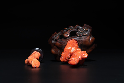 Two Chinese red coral sculptures of ladies on wooden stand, 19/20th C.