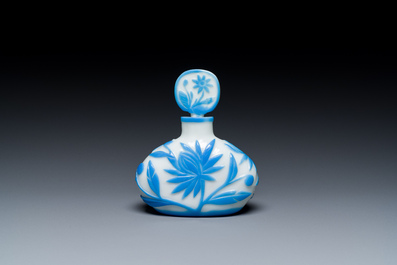 A Chinese blue-overlay white Beijing glass 'meiping' vase, a bowl and a bottle, 19/20th C.