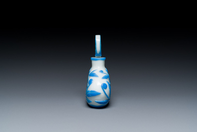 A Chinese blue-overlay white Beijing glass 'meiping' vase, a bowl and a bottle, 19/20th C.