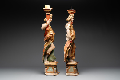A pair of gilt and polychromed wooden angel-form candlesticks, Germany, 18/19th C.