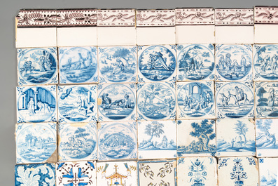 A collection of 54 blue, white, manganese and polychrome Dutch Delft tiles, 17/18th C