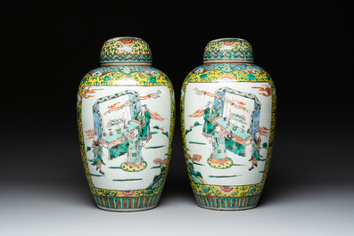 A pair of Chinese famille verte yellow-ground vases and covers with narrative design, 19th C.