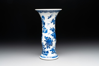 A Chinese blue and white 'gu' vase with birds amongst flowering branches, Kangxi