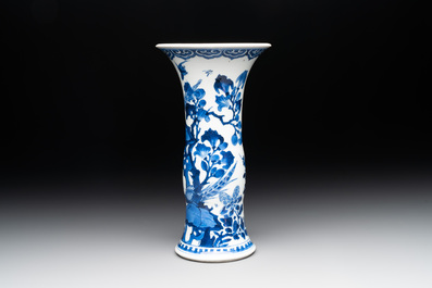 A Chinese blue and white 'gu' vase with birds amongst flowering branches, Kangxi