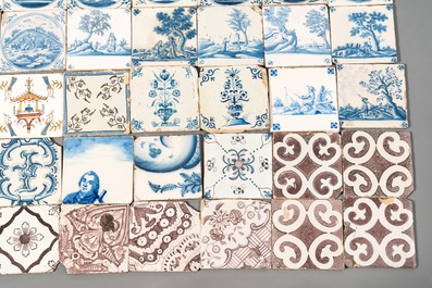 A collection of 54 blue, white, manganese and polychrome Dutch Delft tiles, 17/18th C