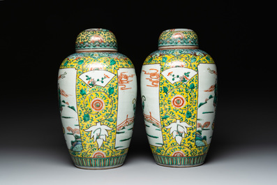 A pair of Chinese famille verte yellow-ground vases and covers with narrative design, 19th C.