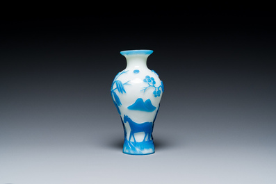 A Chinese blue-overlay white Beijing glass 'meiping' vase, a bowl and a bottle, 19/20th C.