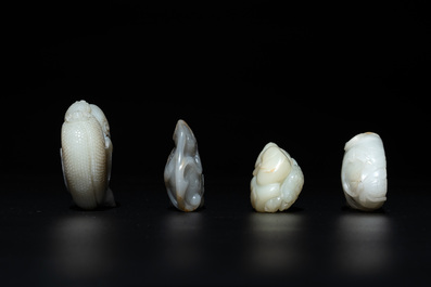 Five Chinese white, celadon and russet jade carvings of three melons, a lotus pod and a lingzhi, 19th C.