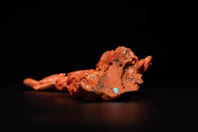 A Chinese red coral female deity holding a fan, 19/20th C.