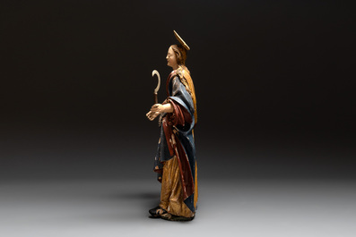 A large gilt and polychromed wooden sculpture of a female saint with a sickle, Germany, 18th C.