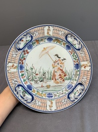 A Japanese Imari 'Parasol Ladies' plate after Cornelis Pronk, Edo, 18th C.