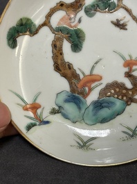 Four Chinese famille rose 'monkey and deer' saucers, Tongzhi mark and of the period