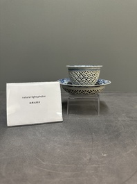 A Chinese blue and white reticulated double-walled cup and saucer, fu mark, Kangxi