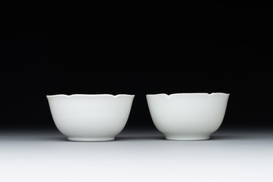 A pair of Chinese eggshell white-glazed cups and saucers, and two famille rose cups, 18th C.