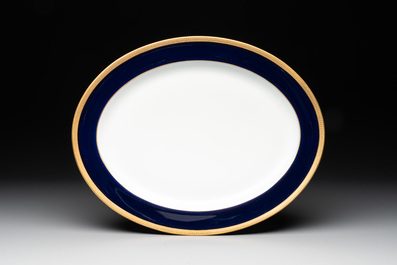 An impressive 94-piece gold-encrusted royal-blue-enamelled 'Palaiseau' service, Bernardaud, Limoges, 20th C.