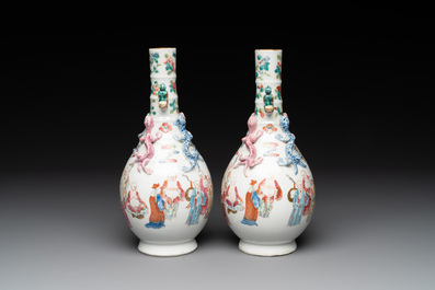 A pair of Chinese famille rose '18 Luohan' bottle vases, 19th C.