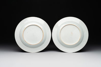 A fine pair of Chinese Canton famille rose 'ladies in the garden' plates, Yongzheng/Qianlong
