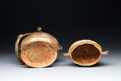 A Chinese archaistic bronze 'you 卣' vessel and cover, an inkstone and two calligraphy brushes, 20th C.