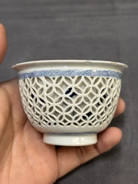 A Chinese blue and white reticulated double-walled cup and saucer, fu mark, Kangxi