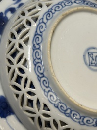 A Chinese blue and white reticulated double-walled cup and saucer, fu mark, Kangxi