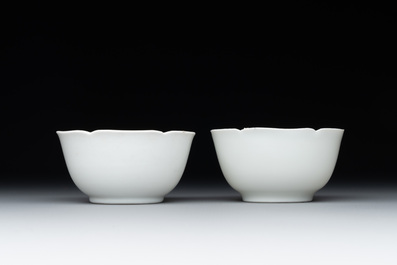 A pair of Chinese eggshell white-glazed cups and saucers, and two famille rose cups, 18th C.