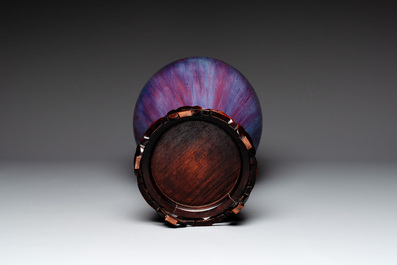 A Chinese flamb&eacute;-glazed 'meiping' vase on wooden stand, 18/19th C.