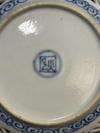 A Chinese blue and white reticulated double-walled cup and saucer, fu mark, Kangxi