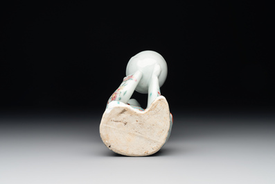 A Chinese famille rose figure of a lady presenting a bowl, Qianlong