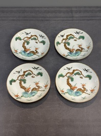 Four Chinese famille rose 'monkey and deer' saucers, Tongzhi mark and of the period