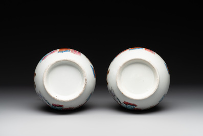 A pair of Chinese famille rose '18 Luohan' bottle vases, 19th C.
