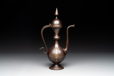 A Persian steel engraved gilt-decorated pear-shaped ewer and cover with floral design, Qajar, 19th C.
