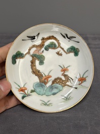 Four Chinese famille rose 'monkey and deer' saucers, Tongzhi mark and of the period