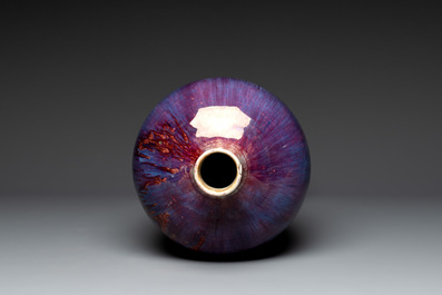 A Chinese flamb&eacute;-glazed 'meiping' vase on wooden stand, 18/19th C.