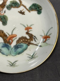 Four Chinese famille rose 'monkey and deer' saucers, Tongzhi mark and of the period