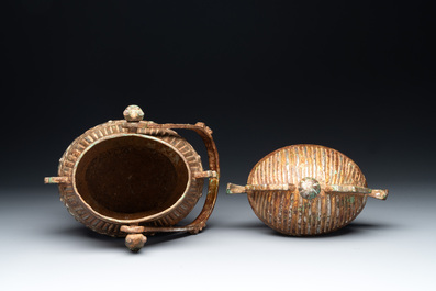 A Chinese archaistic bronze 'you 卣' vessel and cover, an inkstone and two calligraphy brushes, 20th C.