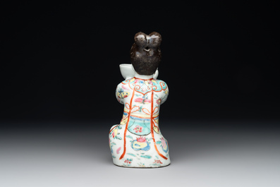 A Chinese famille rose figure of a lady presenting a bowl, Qianlong
