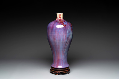 A Chinese flamb&eacute;-glazed 'meiping' vase on wooden stand, 18/19th C.