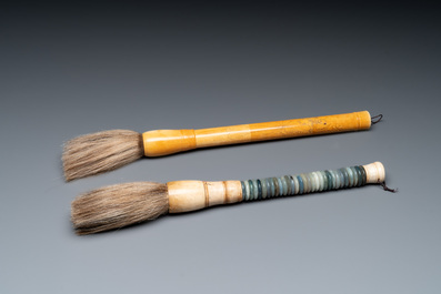 A Chinese archaistic bronze 'you 卣' vessel and cover, an inkstone and two calligraphy brushes, 20th C.