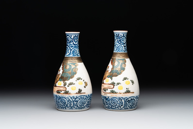 A Japanese lacquerware picnic set with two sake bottles, Meiji, 19th C.