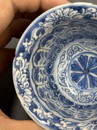 A Chinese blue and white reticulated double-walled cup and saucer, fu mark, Kangxi