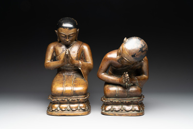 Two Burmese partly lacquered bronze praying monks, 18/19th C.
