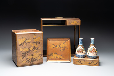 A Japanese lacquerware picnic set with two sake bottles, Meiji, 19th C.
