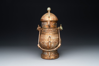 A Chinese archaistic bronze 'you 卣' vessel and cover, an inkstone and two calligraphy brushes, 20th C.