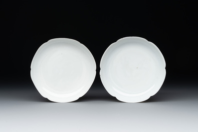 A pair of Chinese eggshell white-glazed cups and saucers, and two famille rose cups, 18th C.