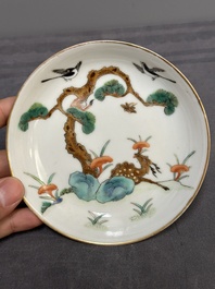 Four Chinese famille rose 'monkey and deer' saucers, Tongzhi mark and of the period