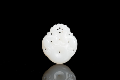 Four Chinese white, celadon and russet jade pendants, Qing/Republic